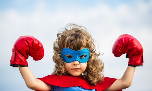 Superhero kid. Girl power concept